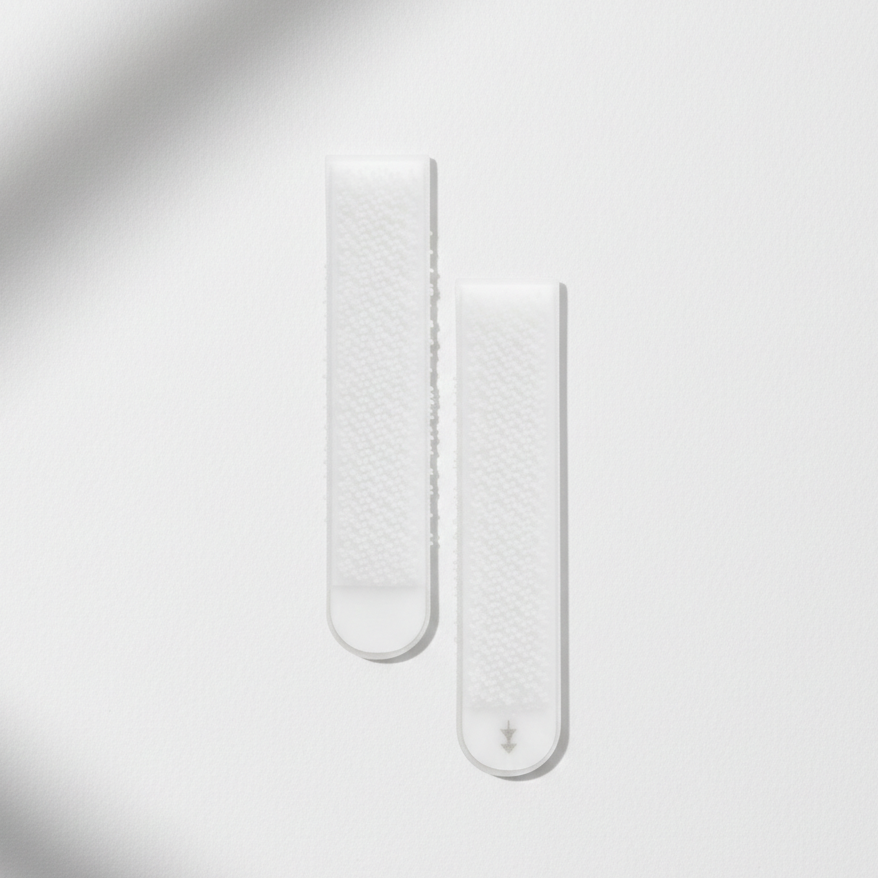 Paire de languettes adhésives professionnelles pour fixation murale de cadres sans clous ni vis.